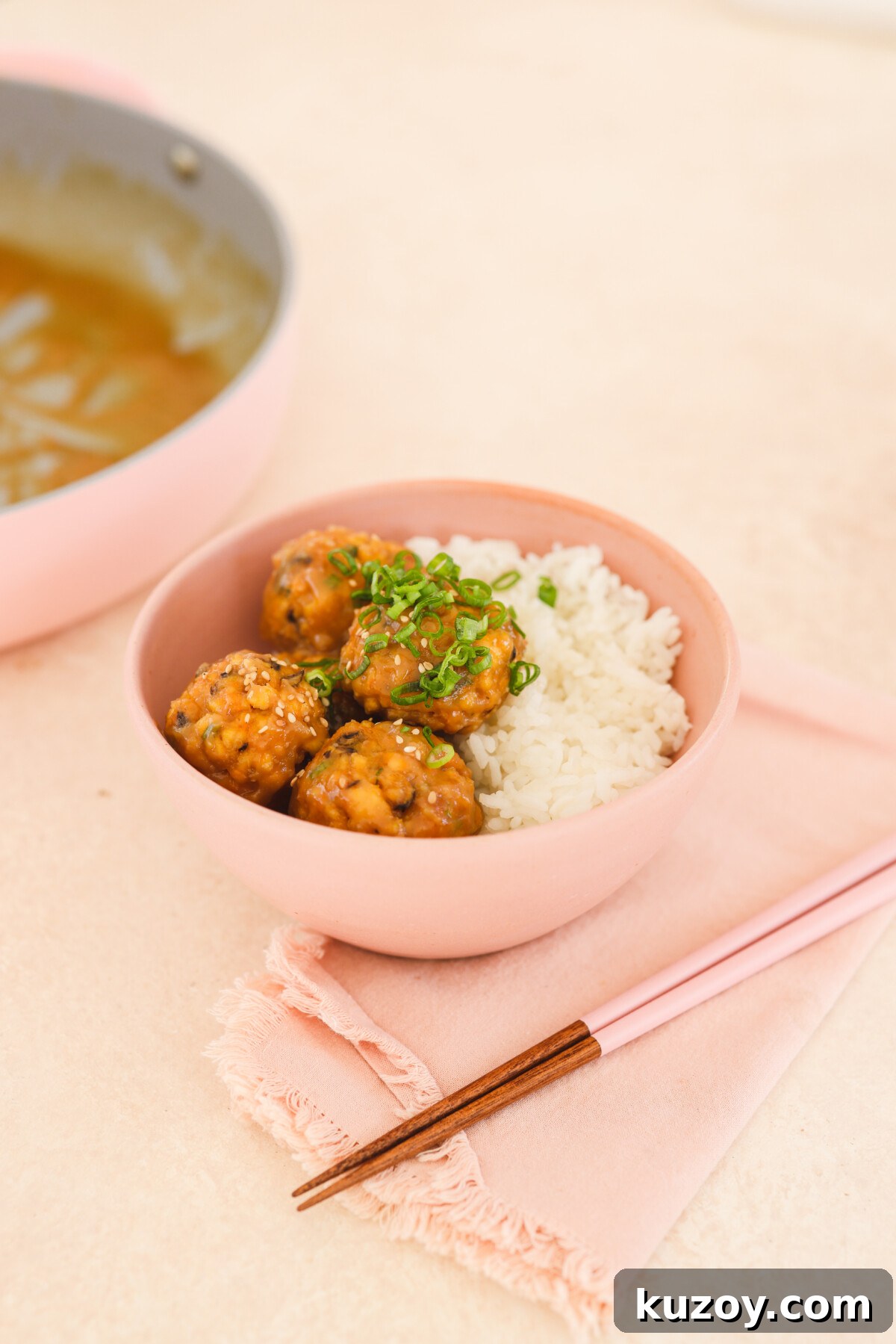 tofu meatballs in a pink bowl with rice