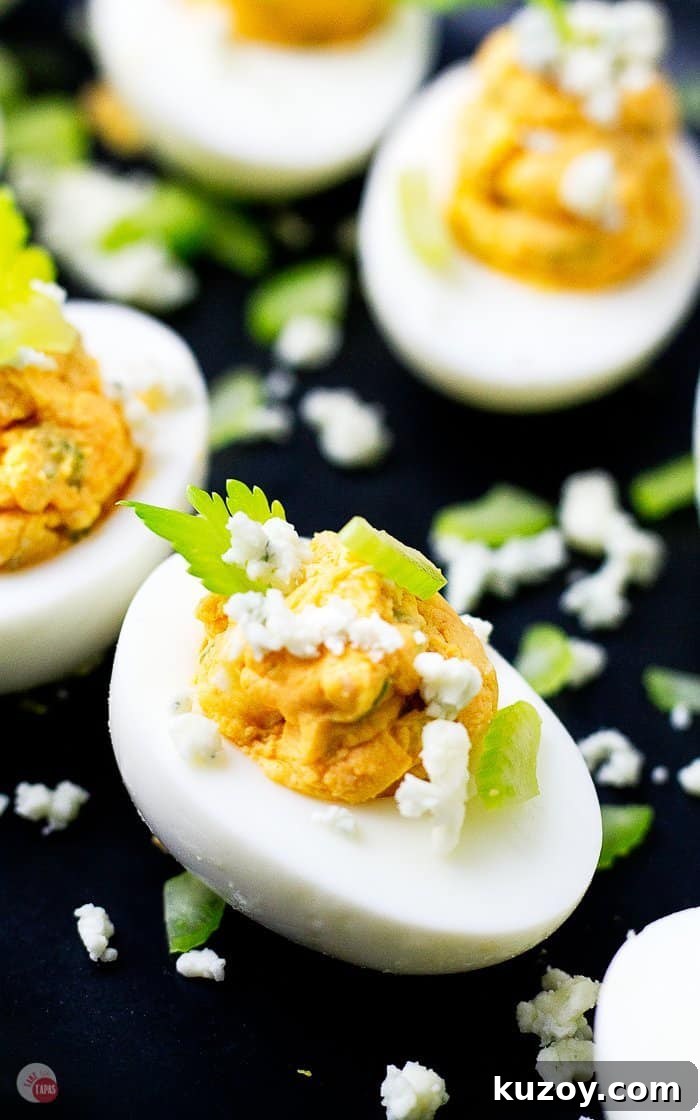 Buffalo Chicken Deviled Eggs Recipe for Game Day or Parties 3 side view of buffalo chicken eggs