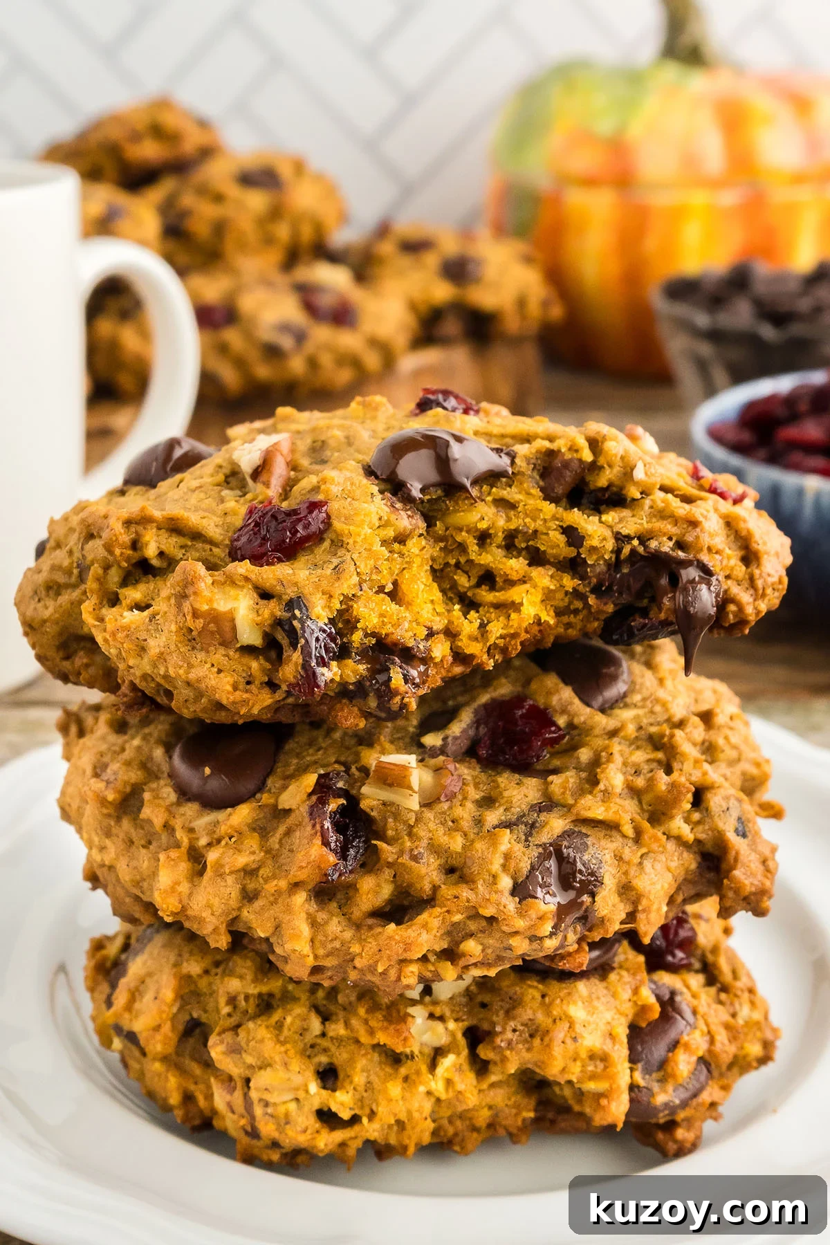 Pumpkin Oat Breakfast Cookies — Ready in 30 Minutes 2 Three Pumpkin Breakfast Cookies stacked together on a plate.