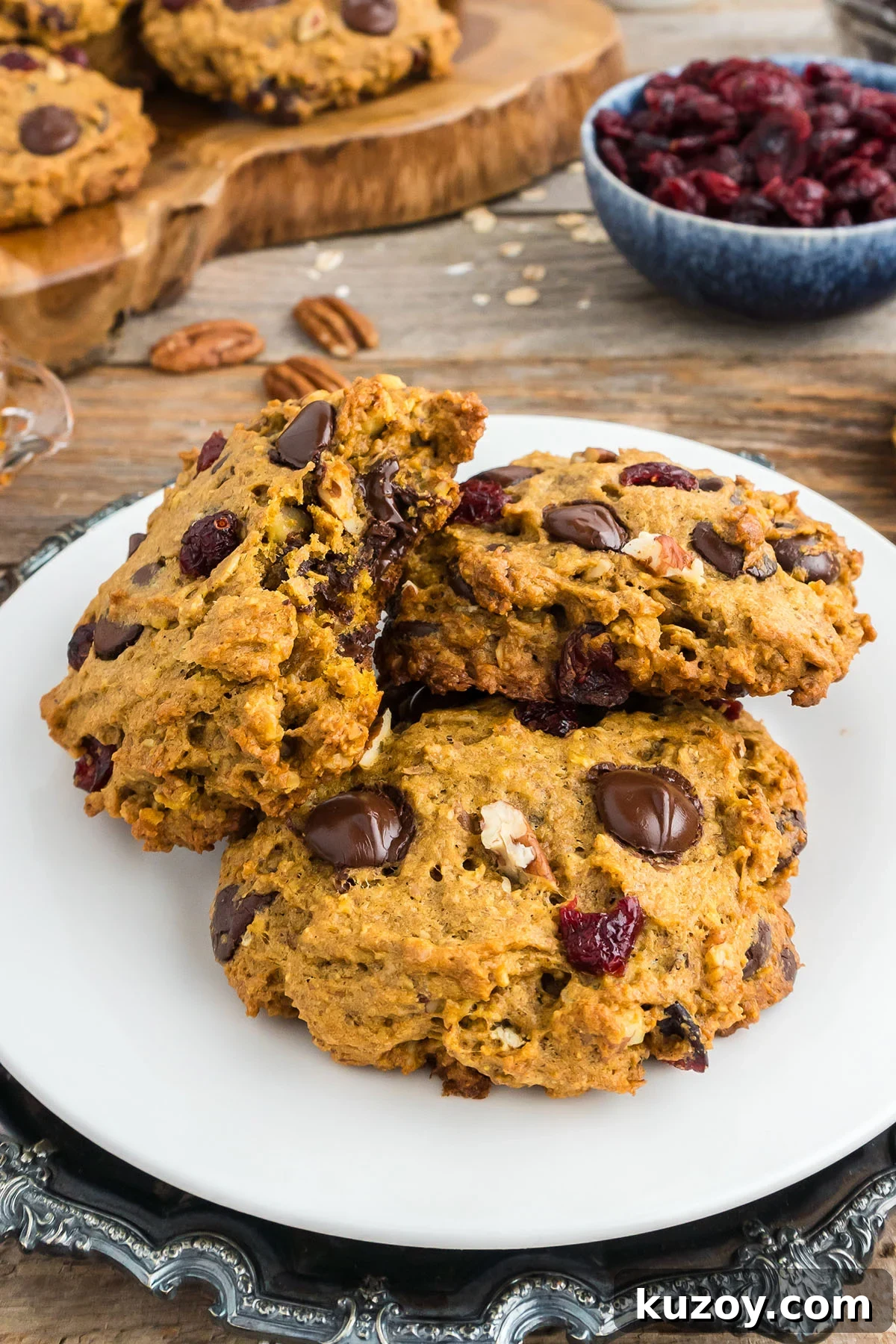 Pumpkin Oat Breakfast Cookies — Ready in 30 Minutes 11 Three Pumpkin Breakfast Cookies on a white plate.
