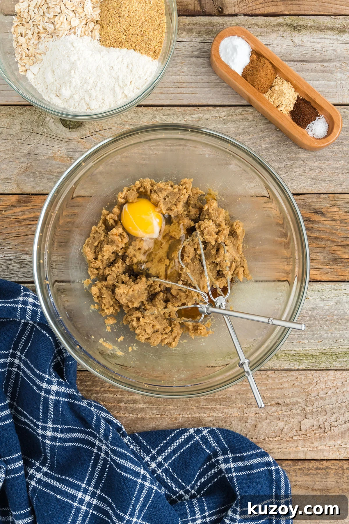 Pumpkin Oat Breakfast Cookies — Ready in 30 Minutes 5 Egg and vanilla added to butter and brown sugar in the glass mixing bowl.