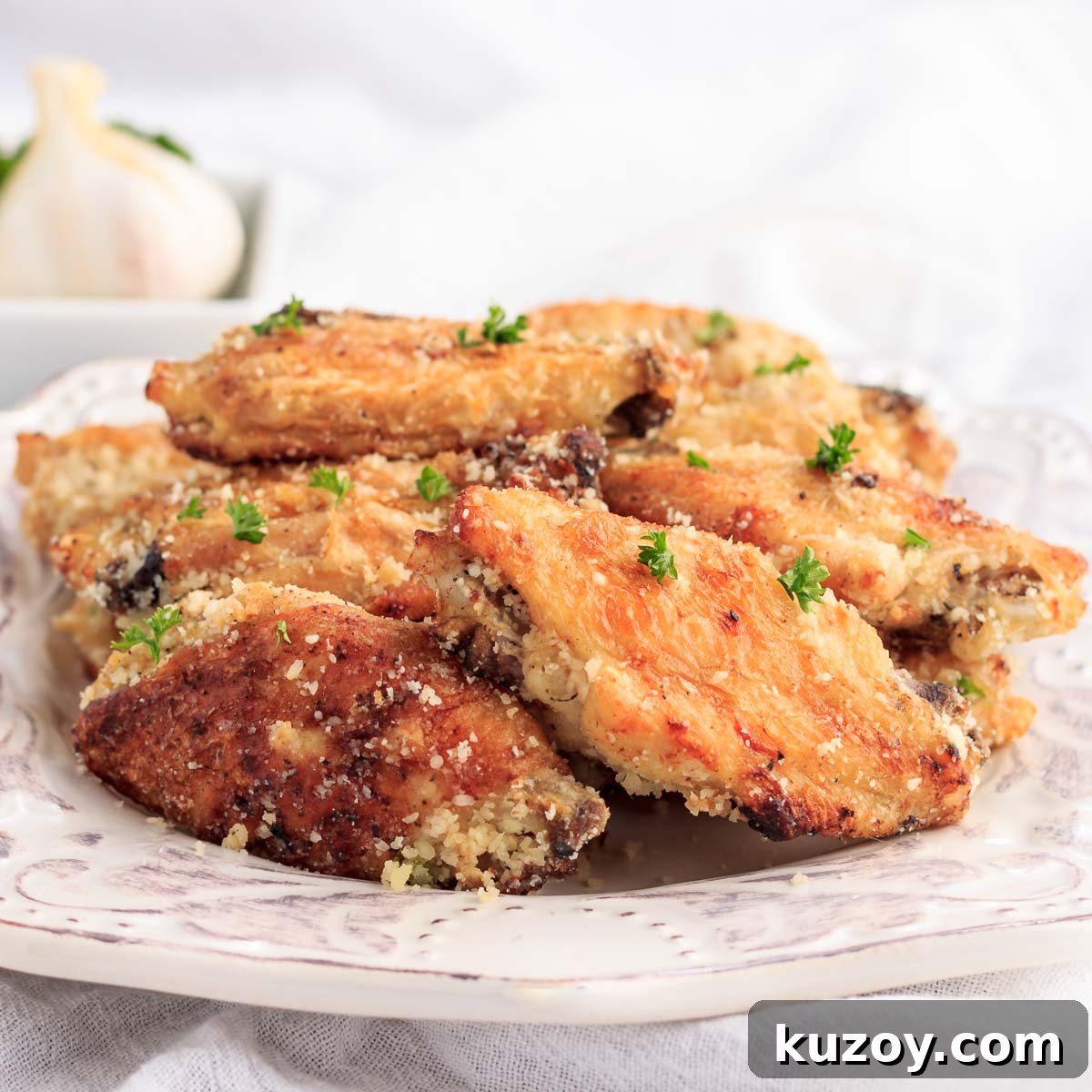Keto Garlic Parmesan Wings in the Air Fryer 2 A plate of garlic parmesan chicken wings.