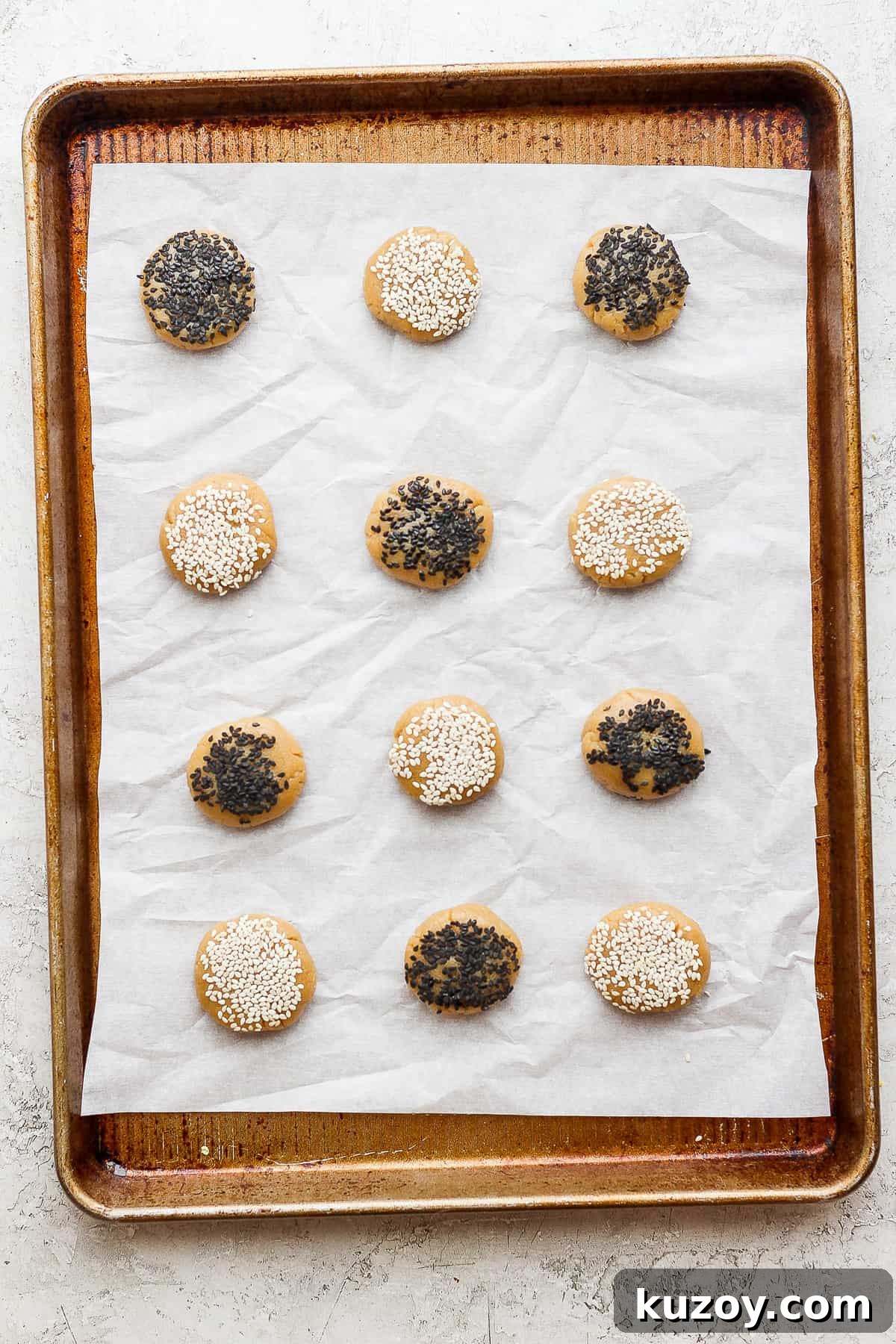 Chewy Tahini Cookies Recipe with Golden Sesame Flavor 11 sesame sesame cookies on a baking sheet.