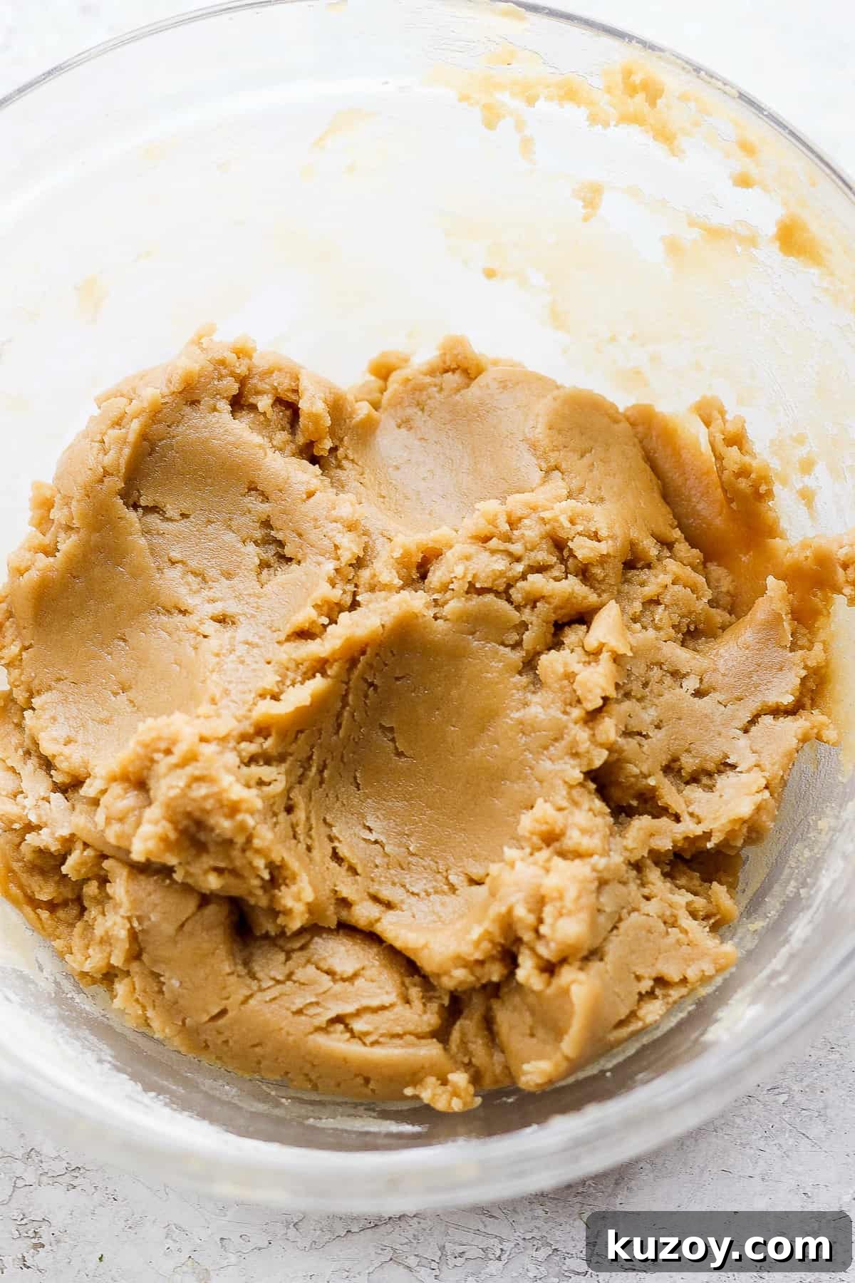 Chewy Tahini Cookies Recipe with Golden Sesame Flavor 9 peanut butter in a glass bowl.
