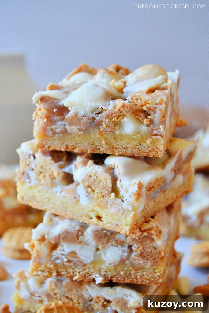 White Chocolate Nutter Butter Magic Bars Recipe 3 four high stack of white choc nutter butter magic bars