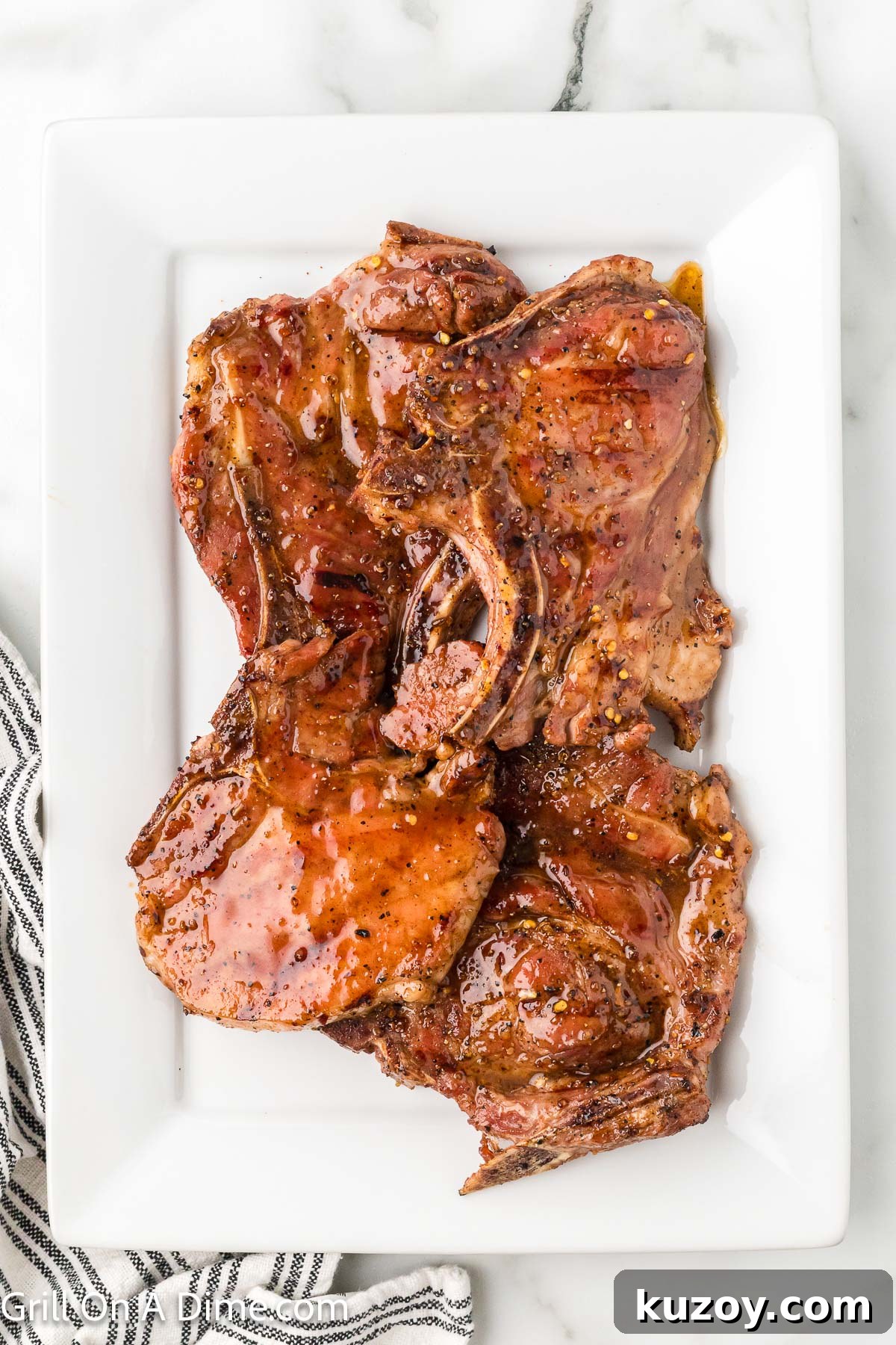 Spicy Honey-Glazed Pork Chops Recipe 10 Hot honey pork chops stacked on a platter