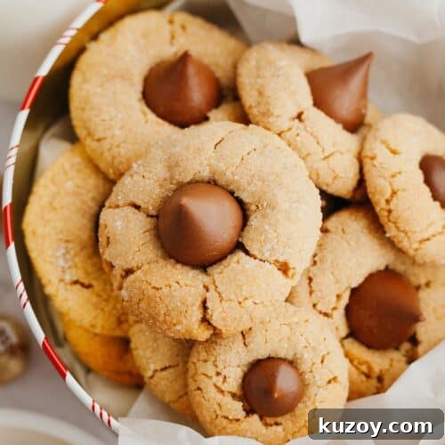 Peanut butter thumbprint cookies in a tin.