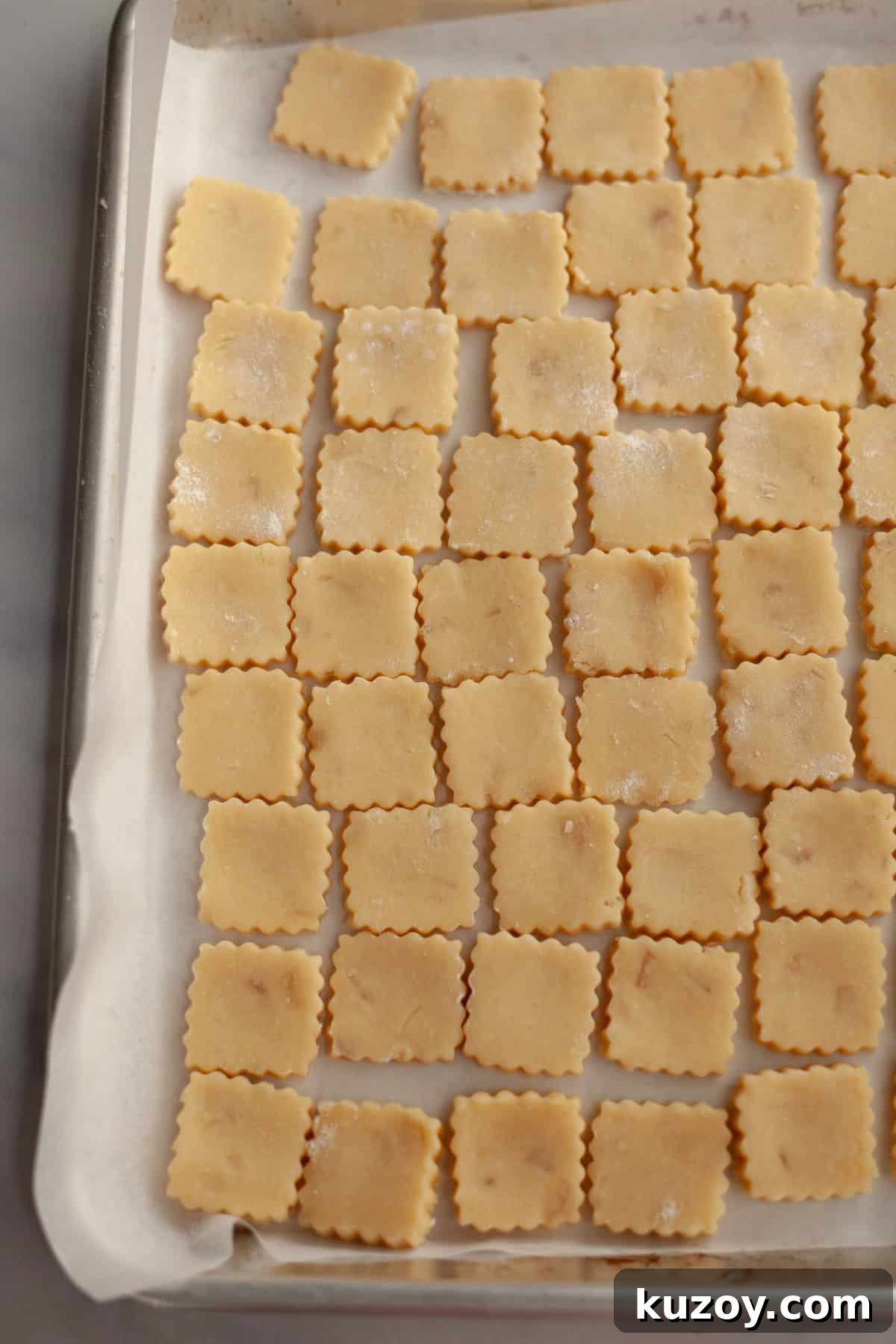 Double-Ginger Shortbread Cookies: Chewy Ginger & Crystallized Chip Recipe 8 Unbaked ginger cookies on a parchment lined baking sheet.