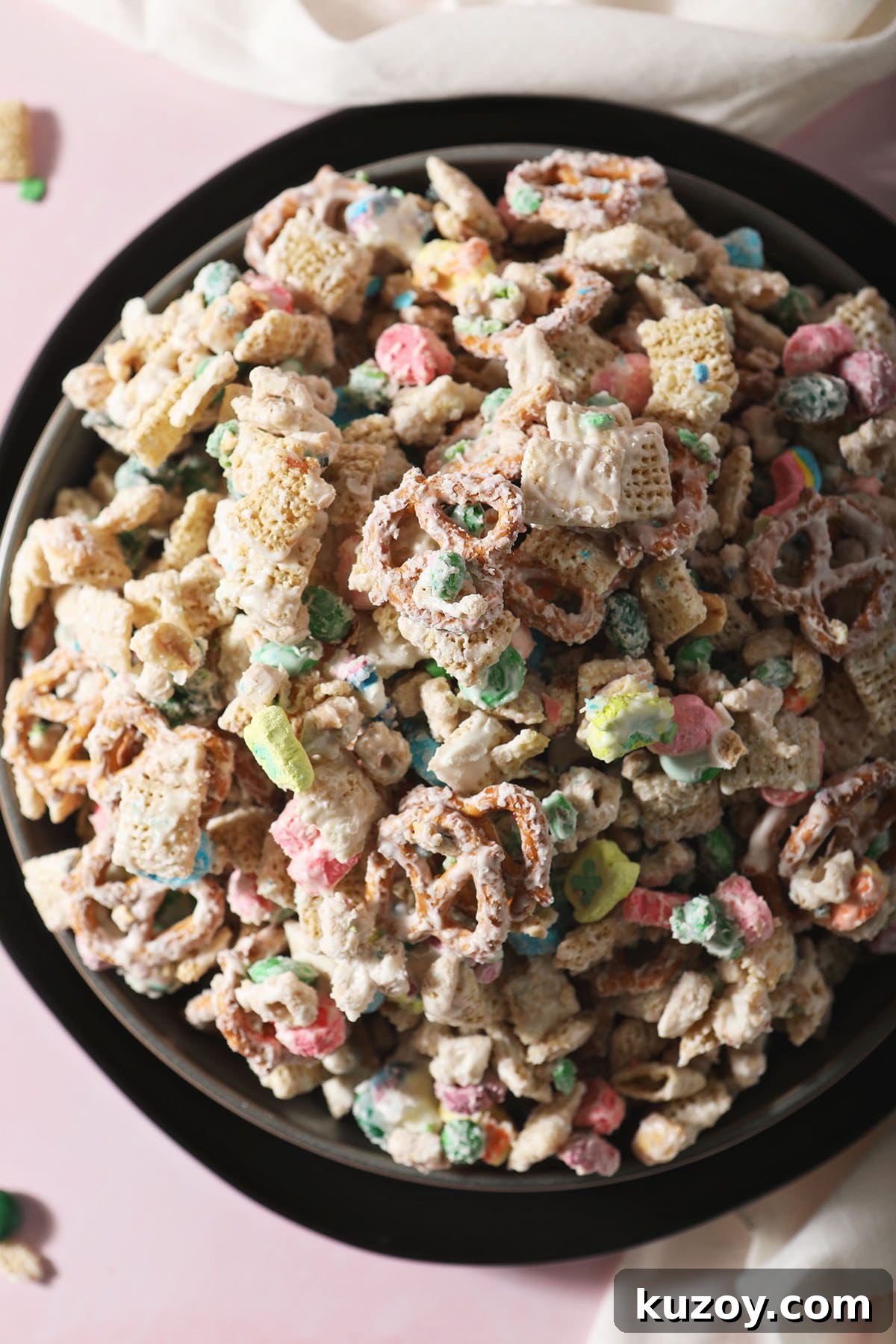 St. Patrick’s Day Snack Mix Recipe for Festive Parties 2 A bowl of St. Patrick's Day Snack Mix on a black plate