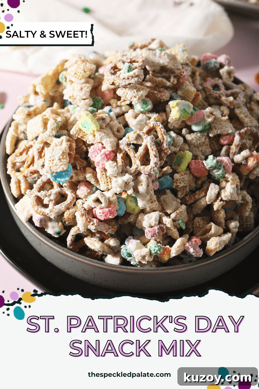 St. Patrick’s Day Snack Mix Recipe for Festive Parties 8 Close up of a black bowl holding a sweet chex mix recipe with candies and marshmallows with the text St. Patrick's Day Snack Mix