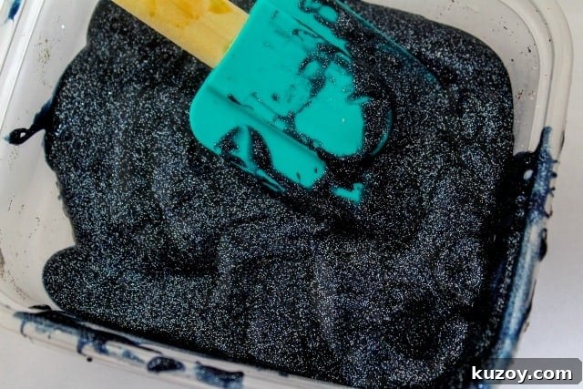 Galaxy Slime Recipe: Step-by-Step Guide for Sparkling Space Slime 4 black glitter glue in a bowl