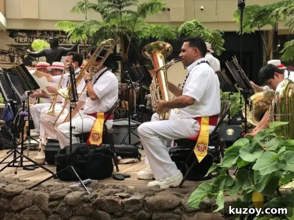 Waikīkī Live Music & Hula Show Guide (Updated 2026) 5 The Royal Hawaiian Band playing at the Queen's Court at the International Market Place.
