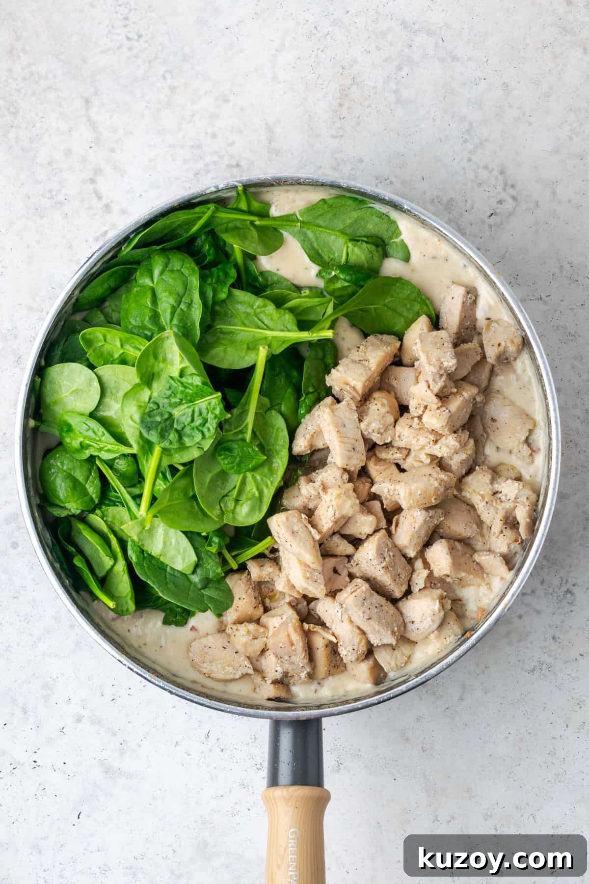 30-Minute Marry Me Chicken Pasta Recipe for Date Night 12 Baby spinach and cooked chicken added to the pot with the Parmesan sauce.