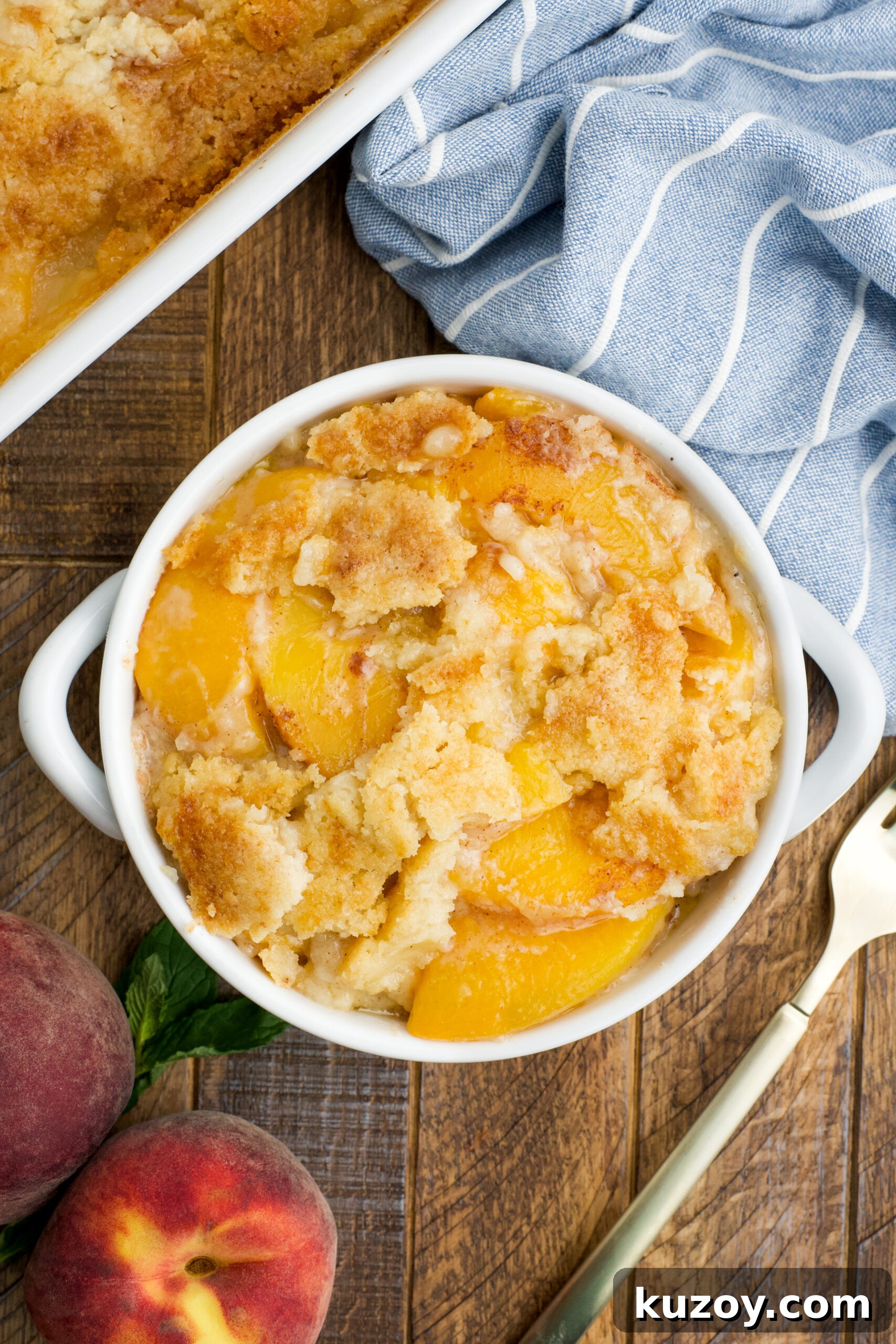 No-Bake Peach Dump Cake Recipe for Quick Summer Dessert 5 Overhead view of a serving of Peach Dump Cake in a white bowl.