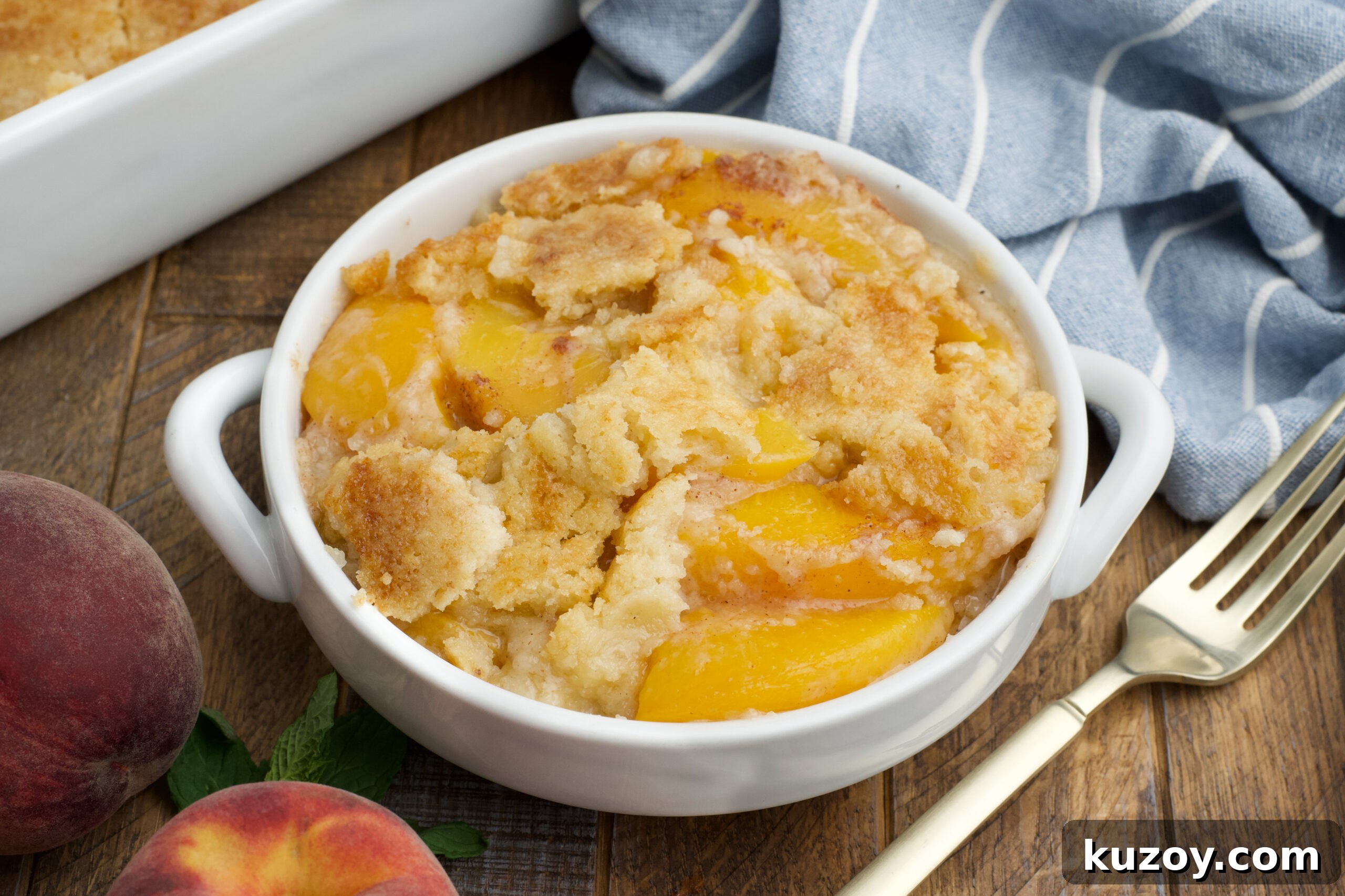 No-Bake Peach Dump Cake Recipe for Quick Summer Dessert 6 Overhead view of a serving of Peach Dump Cake in a white bowl.