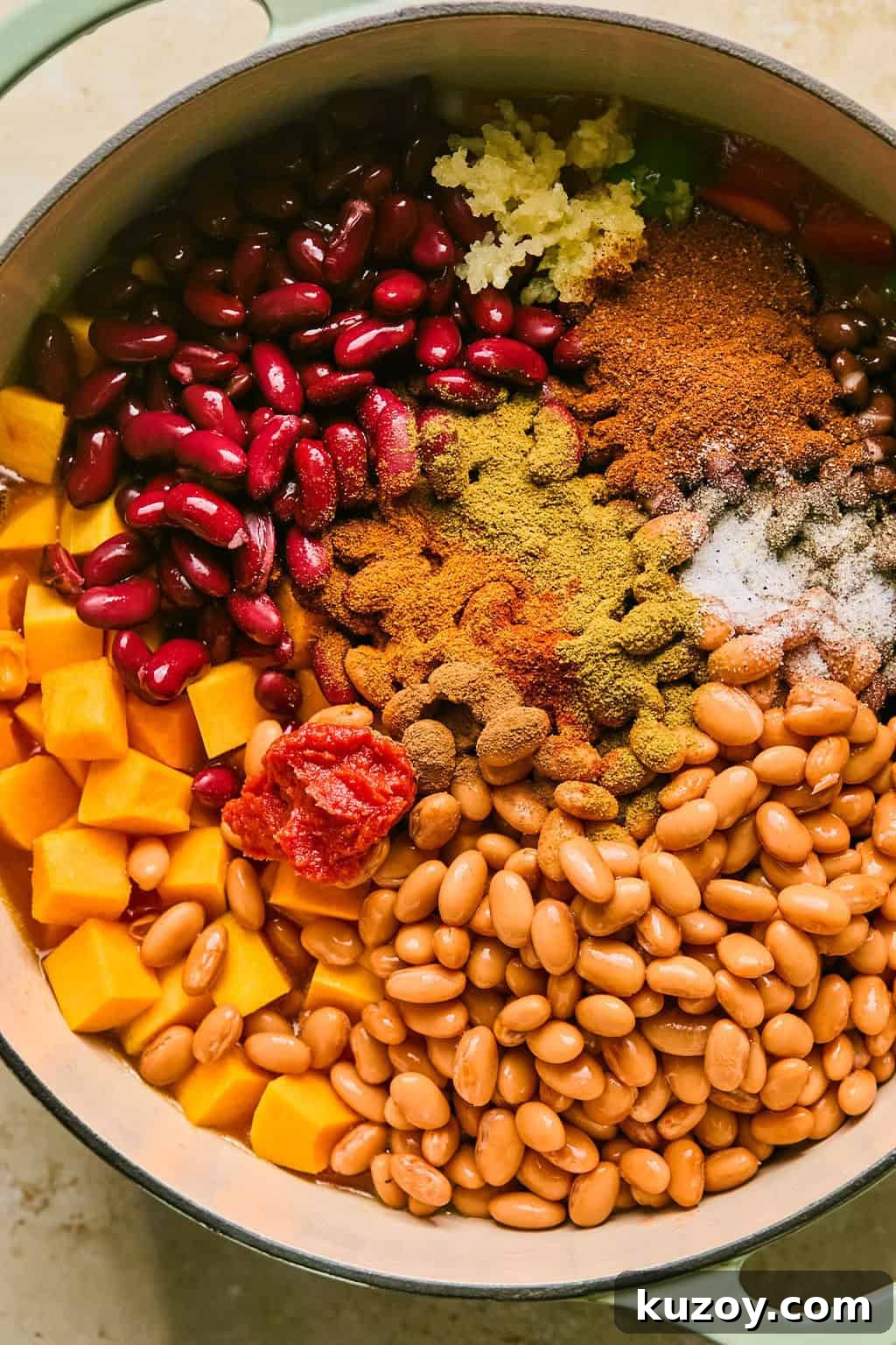 Hearty Butternut Squash & White Bean Chili Recipe 6 Beans, squash, seasoning, green chiles and other ingredients added to stock pot.