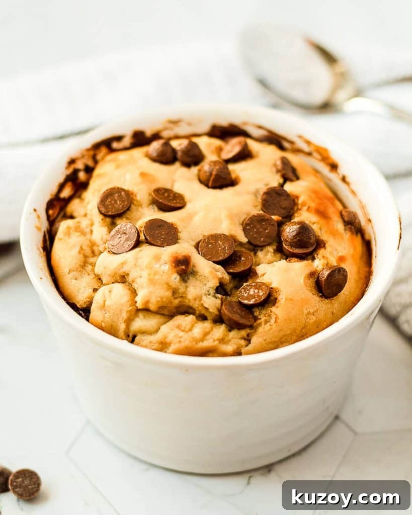 A chocolate chip cookie in a mug.