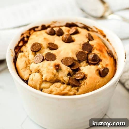 A chocolate chip cookie in a mug.