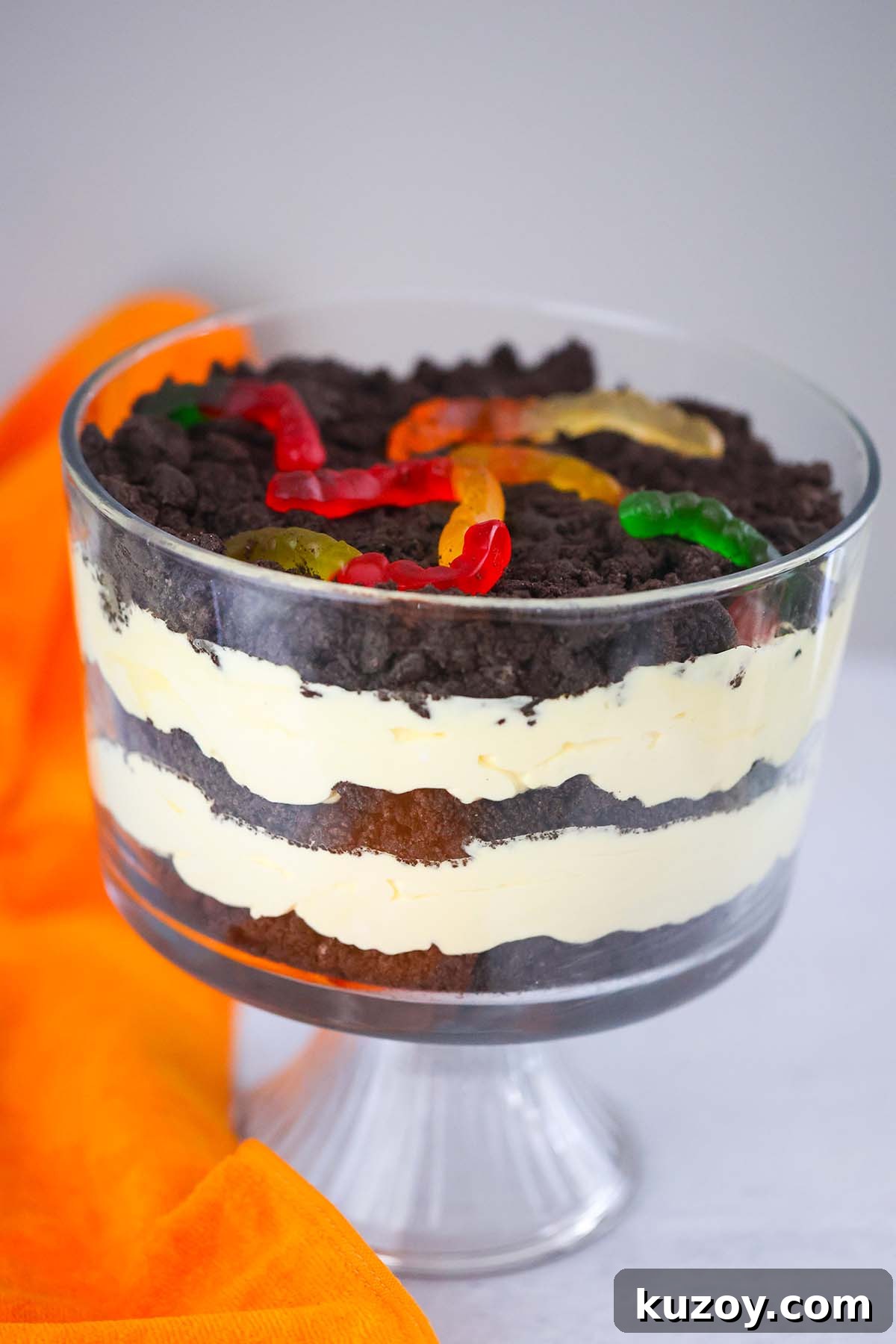 No-Bake Oreo Dirt Cake Recipe: Creamy, Crowd-Pleasing Dessert 5 Oreo dirt cake in a glass trifle bowl.