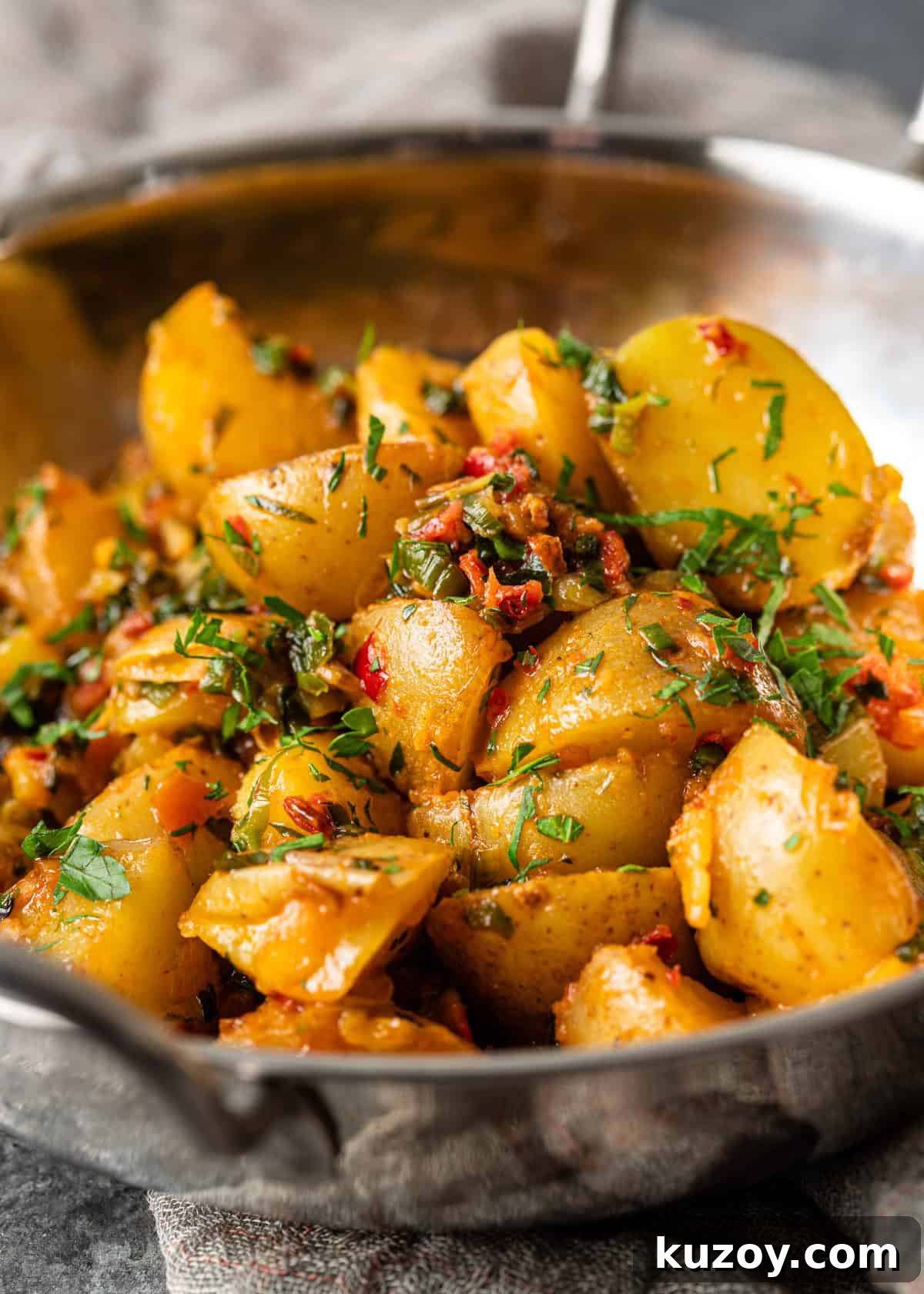 closeup: calabrian potatoes topped with chili and herb butter