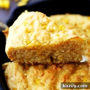 Buttery Skillet Cornbread: Crispy Edges, Tender Crumb 2 A slice of freshly baked cornbread coming away from the skillet