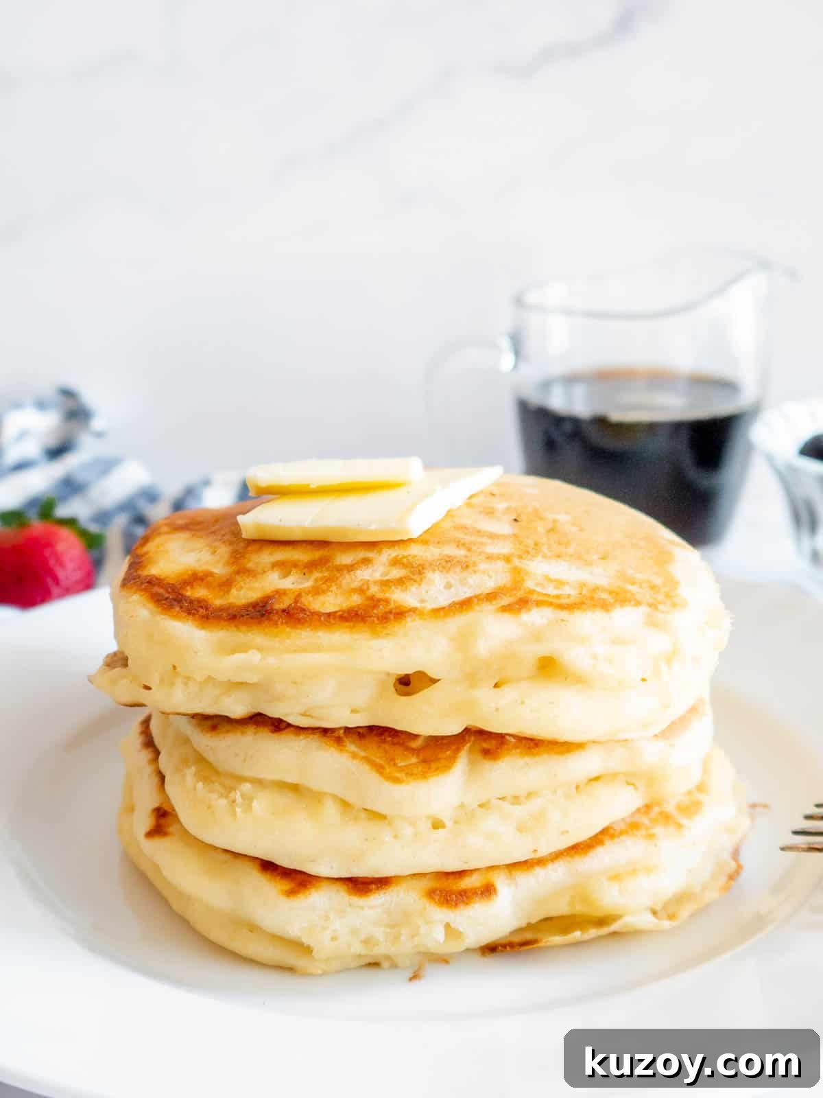 Fluffy Greek Yogurt Pancakes for Light, Protein-Packed Breakfast 9 Greek yogurt protein pancakes stacked on top of each other.