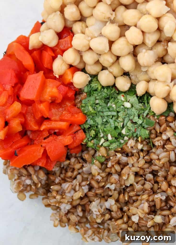 Rye Berry Salad with Chickpeas, Roasted Red Peppers & Arugula 4 rye berries, red peppers, chickpeas and herbs in a bowl