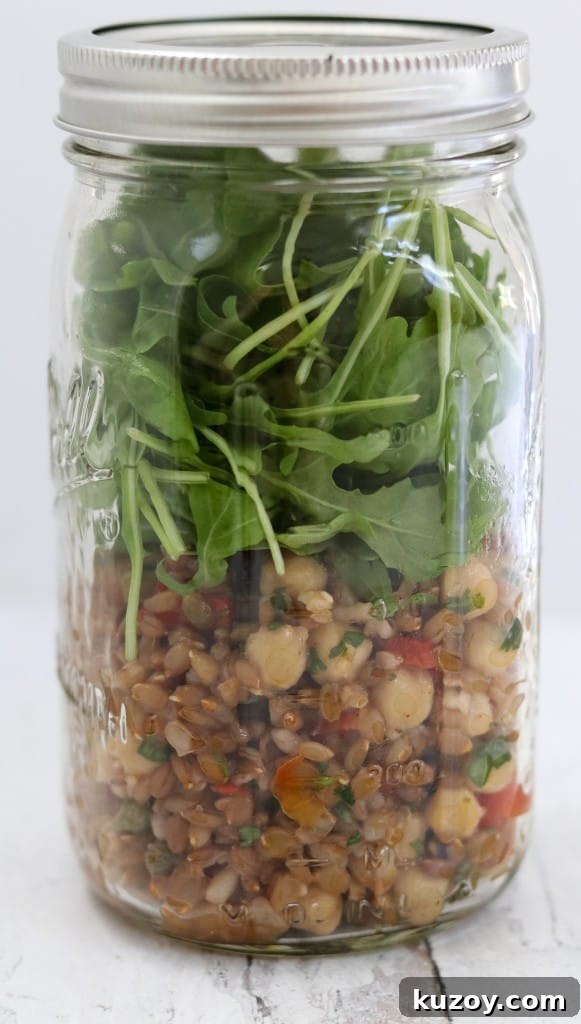 Rye Berry Salad with Chickpeas, Roasted Red Peppers & Arugula 7 Rye berry salad and arugula leaves in a jar