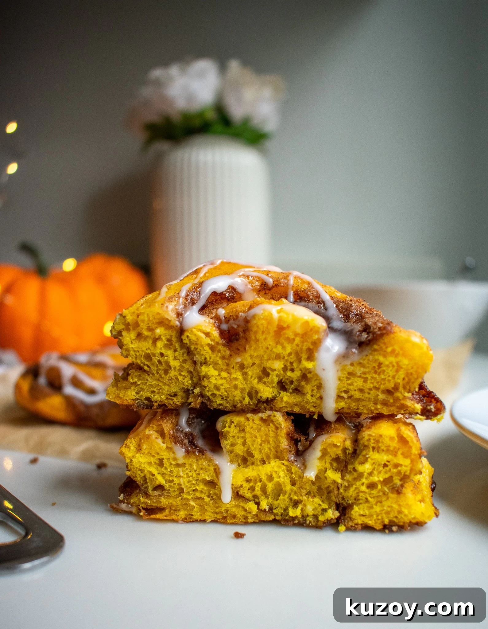Pumpkin Spice Cinnamon Rolls with Spiced Sugar Glaze 4 A cross section of a pumpkin cinnamon roll.