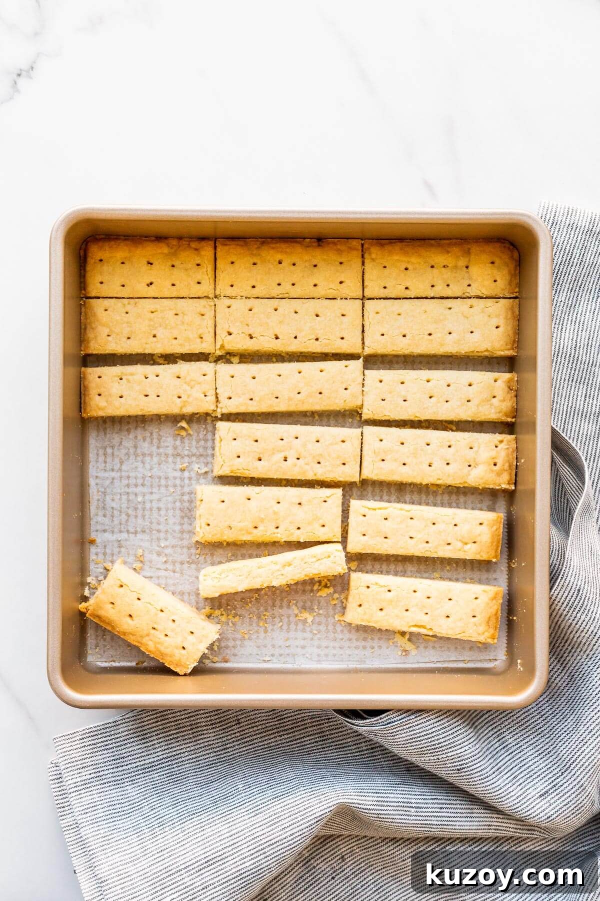 Simple 1-2-3 Shortbread Cookies Recipe for Perfect Crunch 6 A pan of buttery shortbread cookies cut into sticks.