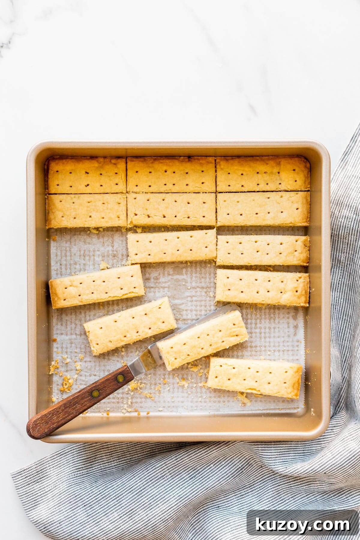 Simple 1-2-3 Shortbread Cookies Recipe for Perfect Crunch 7 Shortbread cookies cut into sticks being served from the square pan they were baked in.
