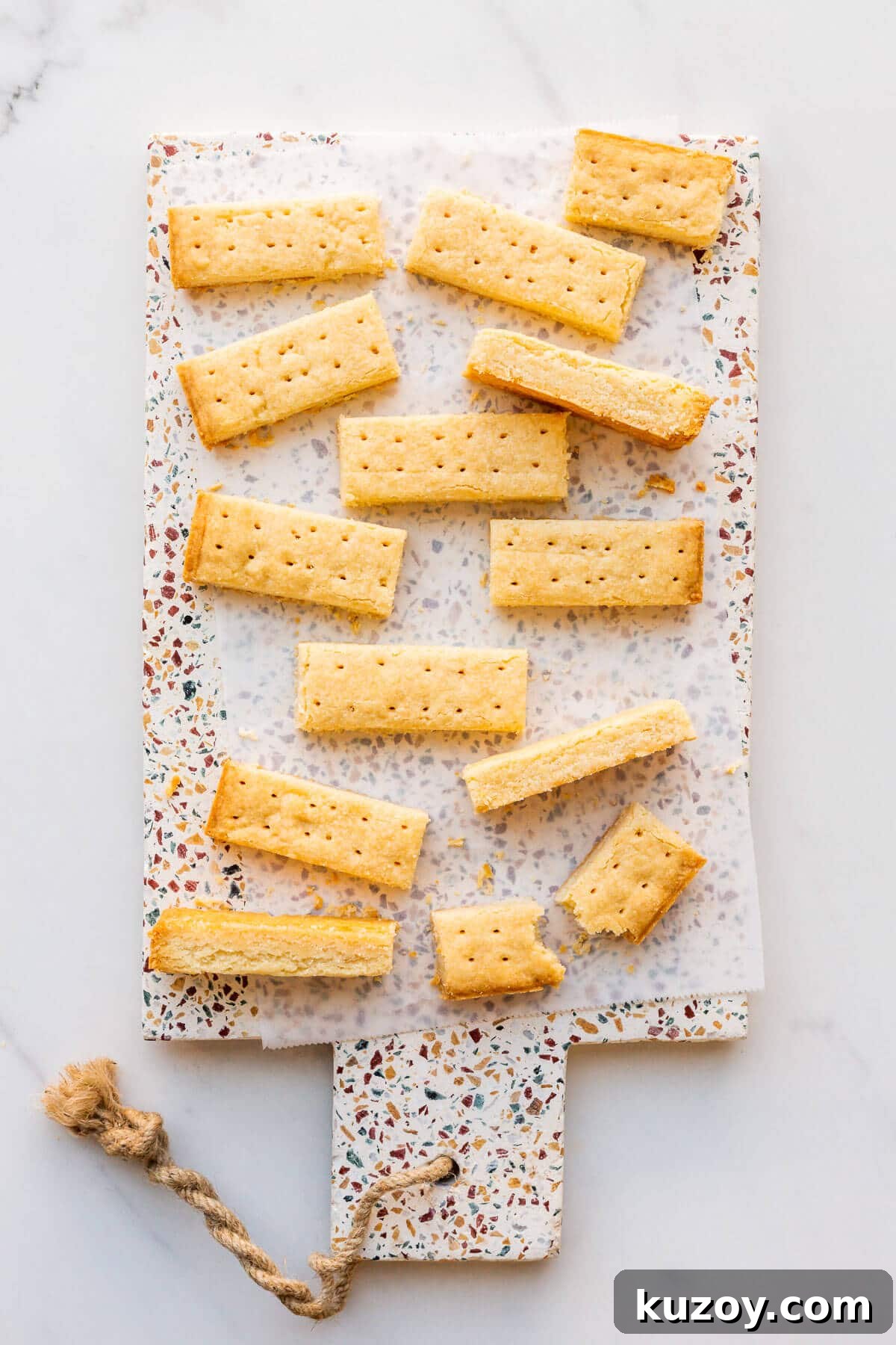 Simple 1-2-3 Shortbread Cookies Recipe for Perfect Crunch 8 Shortbread cookie sticks on a terrazzo platter.