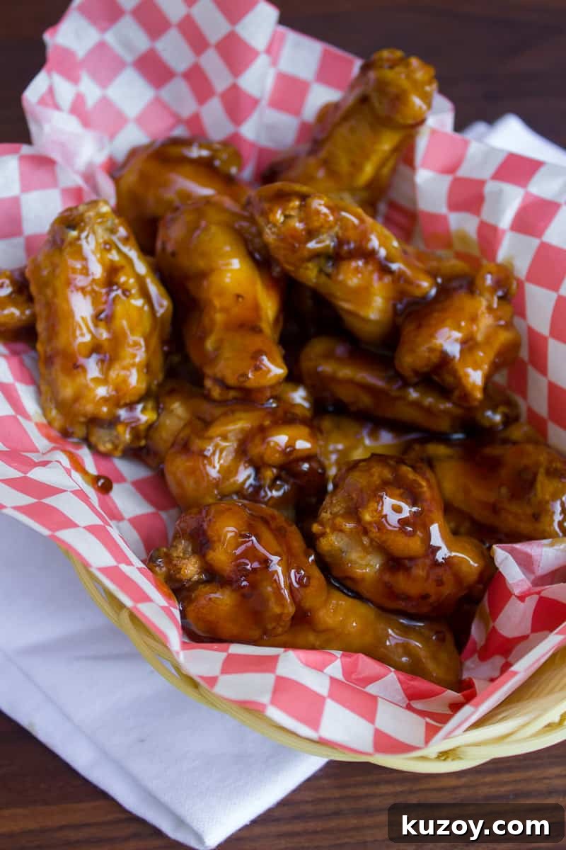 Sticky Honey Garlic Chicken Wings Recipe (Crispy & Flavorful) 2 An overhead image of a basket of chicken wings.