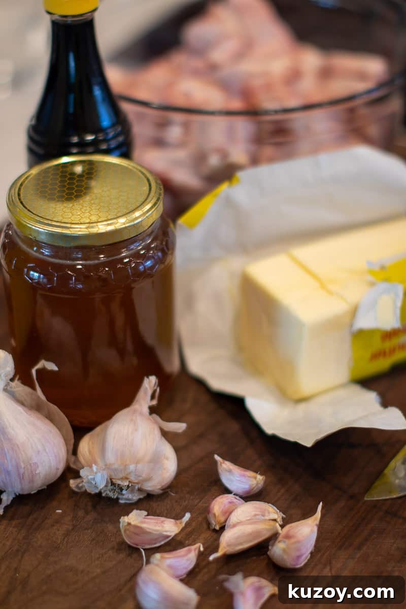 Sticky Honey Garlic Chicken Wings Recipe (Crispy & Flavorful) 3 An image of butter, garlic, honey and soy sauce.