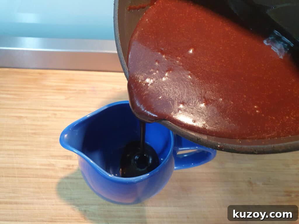 pouring sauce into jug.