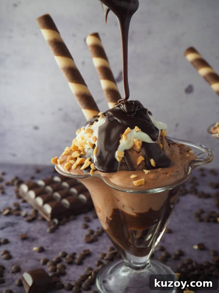 adding more chocolate sauce.