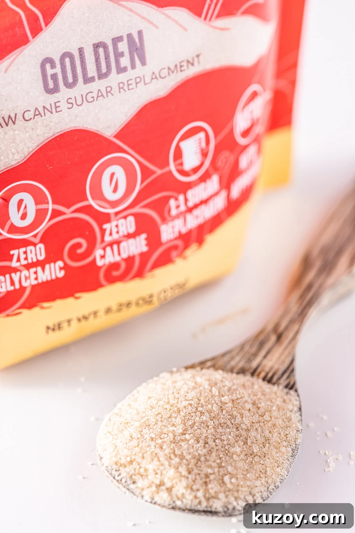 Monk Fruit Guide: Uses, Benefits, Risks, and How to Use 3 A spoonful of golden granulated monk fruit on a white background