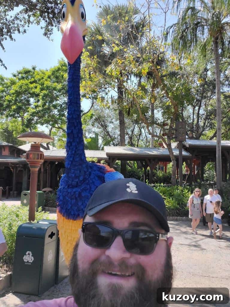 Meet Kevin: Character Meet-and-Greet Guide at Animal Kingdom 4 Guest taking a photo with Kevin