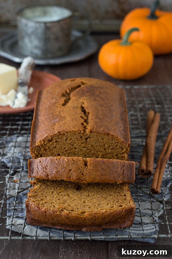 Copycat Starbucks Pumpkin Bread Recipe: Moist Loaf with Spices 6 pumpkin bread loaf sliced into 2 pieces on metal cooling rack