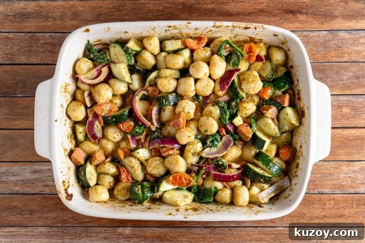 baked pesto gnocchi with chorizo and vegetables top down
