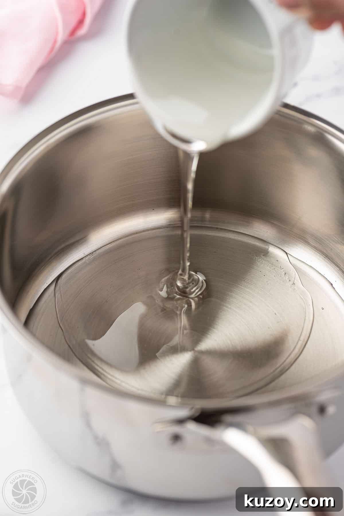 How to Make Smooth Homemade Caramel Sauce for Desserts 10 Pouring corn syrup into a pan.