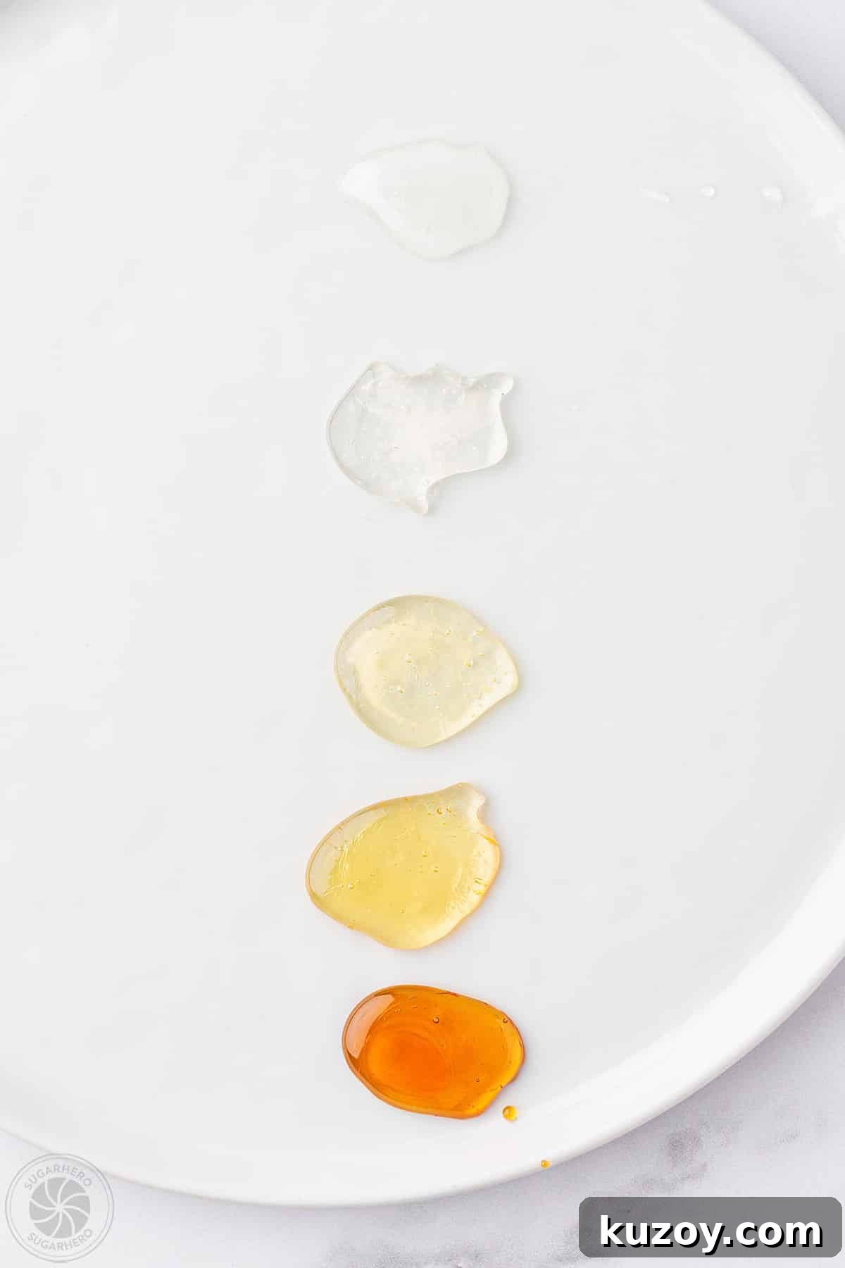 How to Make Smooth Homemade Caramel Sauce for Desserts 14 Five drops of sugar to show the process of color change when making caramel sauce.