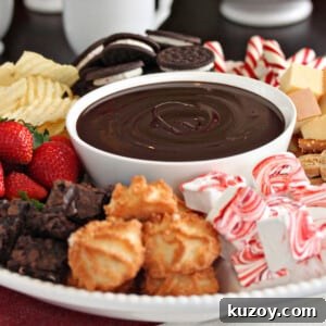 How to Make Smooth Homemade Caramel Sauce for Desserts 7 A bowl of Dark Chocolate Fondue surrounded by dippables.