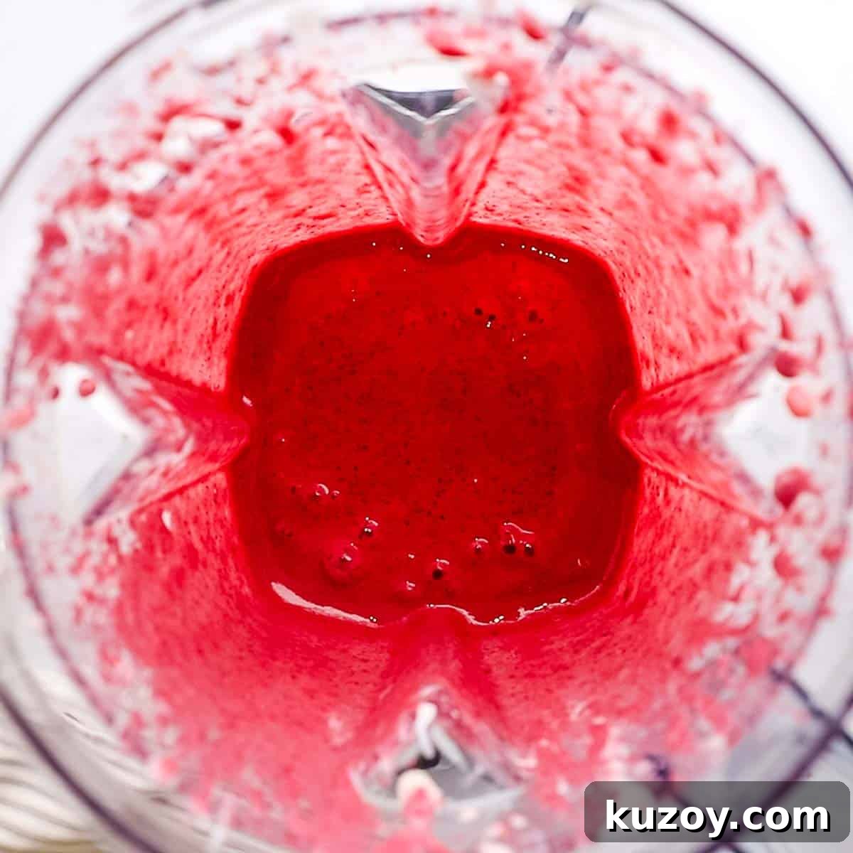 blended triple berry smoothie in a blender