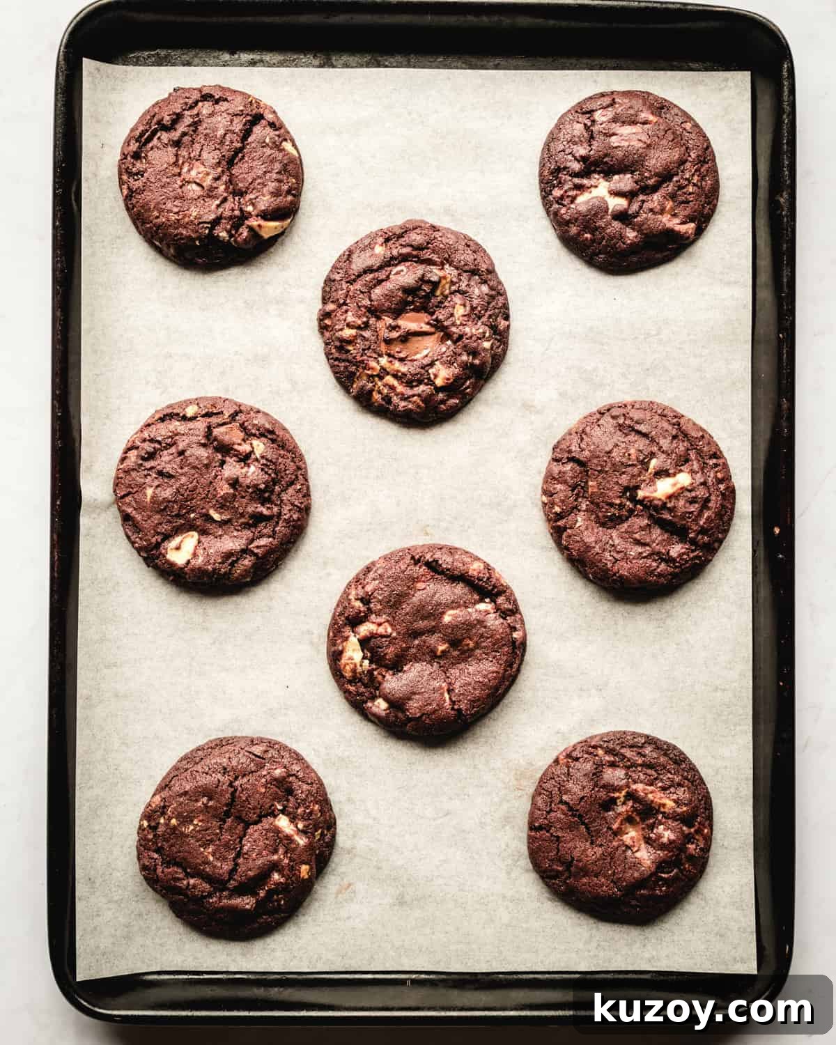 white chocolate chip chocolate cookies on a baking sheet