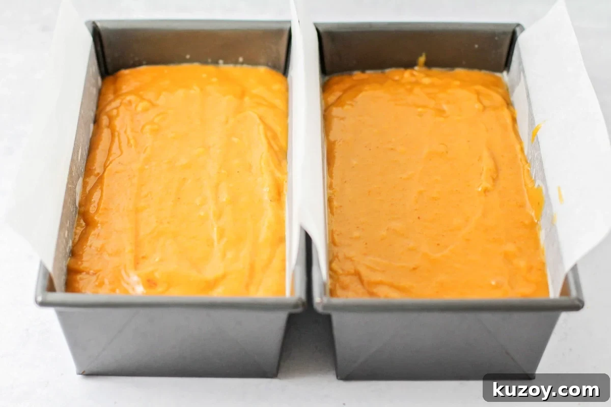 Deliciously tender, easy pumpkin bread is topped with cinnamon and sugar for a family-favorite fall treat you can enjoy on repeat. To loaf pans filled with batter and ready to bake.
