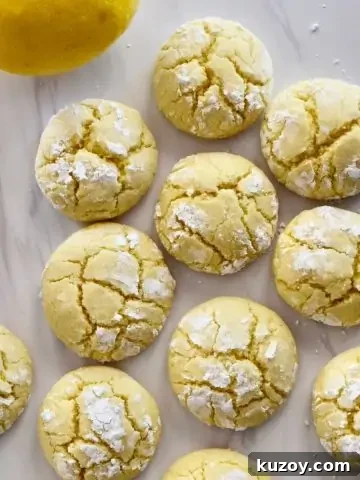 overhead photo of soft lemon cookies on a white countertop.