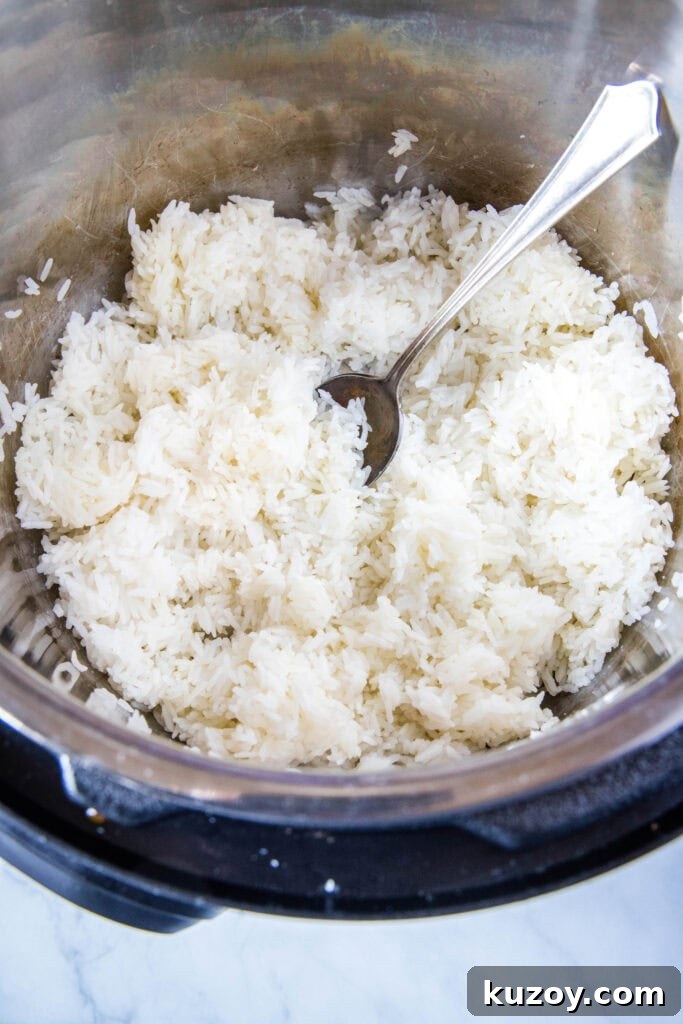 jasmine rice cooked in the instant pot fluffed and ready to serve