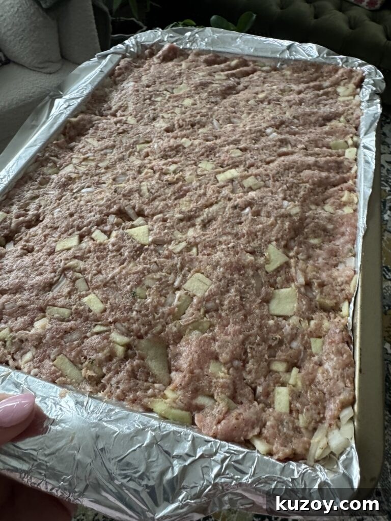 Sheet-Pan Breakfast Sausage and Roasted Veggies for Busy Mornings 4 The sausage mixture in the baking pan before cooking