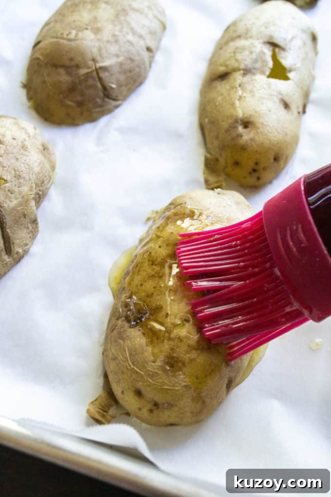 Crispy Stuffed Potato Skins with Cheesy Bacon Filling 7 butter brushing